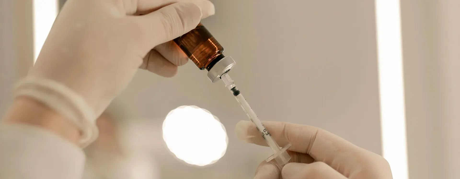 Clinician preparing a precise hormone injection — Ideal Medical, Aventura