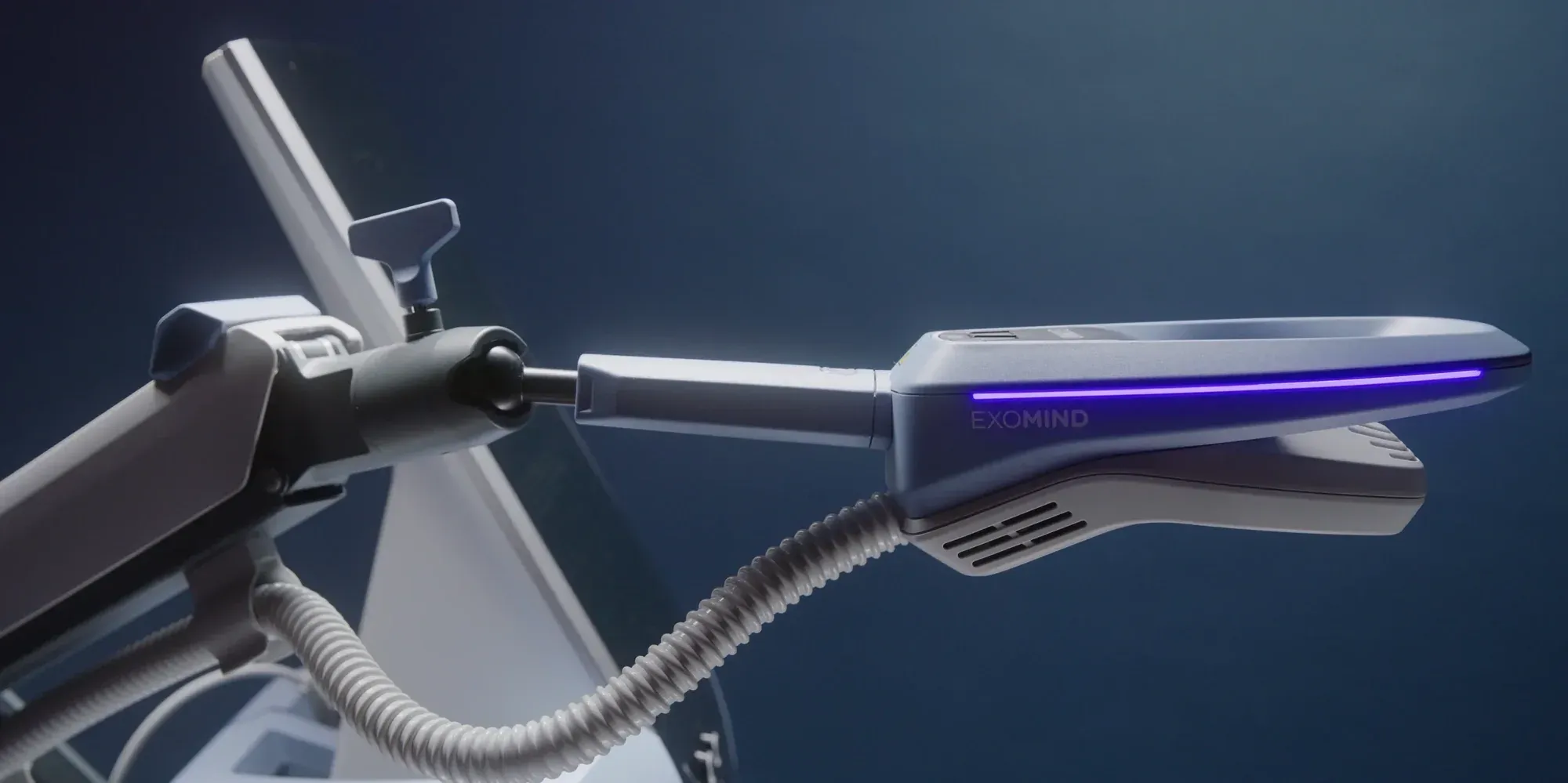 Close-up of the ExoMind TMS device with illuminated coil