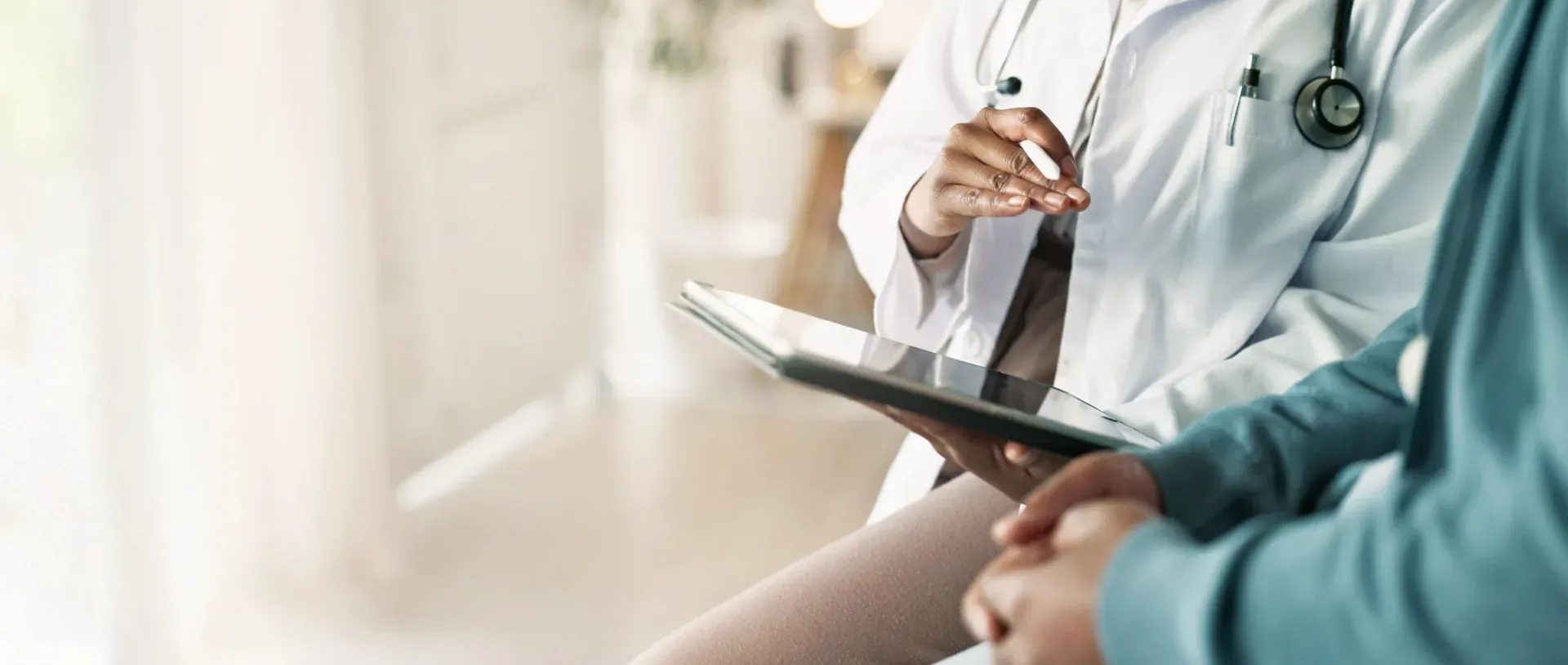 Doctor reviewing patient hormone test results in Aventura clinic